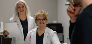 DeAnne and Melissa are welcoming a patient to their office for Primary Care Services.