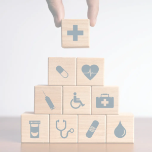 shaded photo of building blocks symbolizing primary care services.